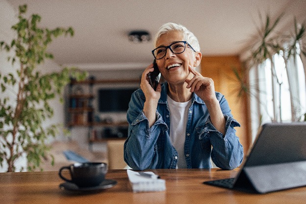 Senior woman smiling and talking on phone