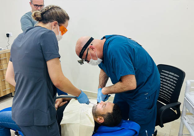 Dentist working on a patients mouth