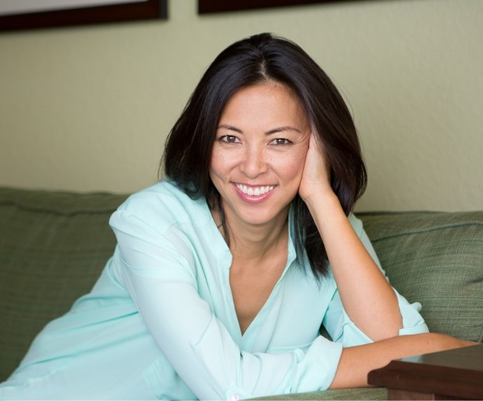 Woman lying on couch and smiling