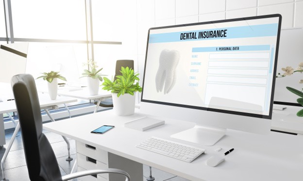 Dental insurance form on a wide computer monitor