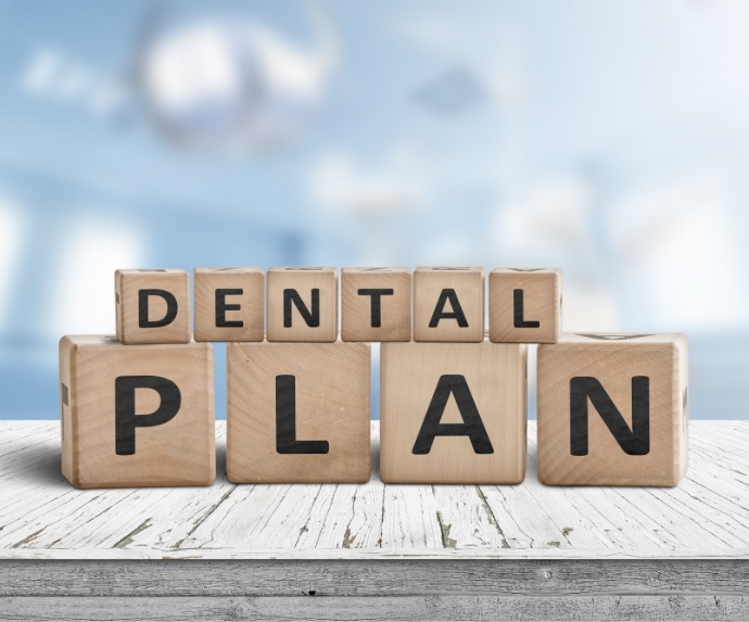 Wooden blocks spelling out dental plan