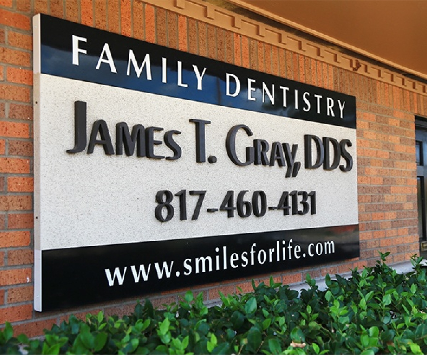 Sign for James T Gray DDS dental office in Arlington