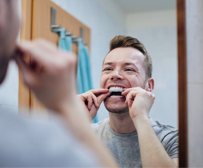 Man putting in tray for teeth whitening
