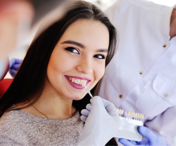 Color matching womans smile for veneers in Arlington