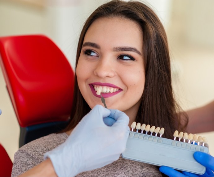 Female dental patient having smile color matched