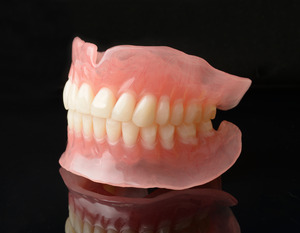 Close up of two full dentures 